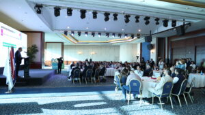 Opening remarks during Lebanon Clusters 2025. Audience listening to Mr. Maroun Chammas addressing his speech.
